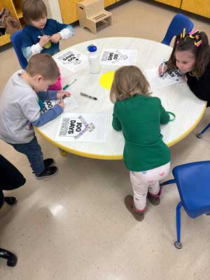 Students coloring together